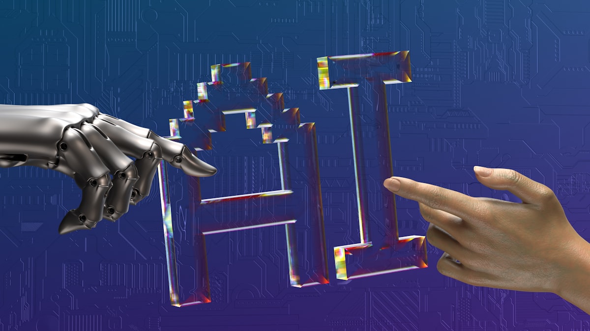 Human and robotic hands reaching toward glowing AI text, representing AI-human collaboration